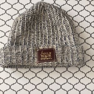 Love Your Melon hat! White and navy speckled with brown patch and gold foil.